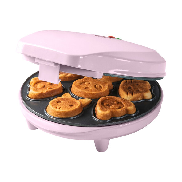 Kleiner, pinkfarbener Mini Cookie Maker mit zwei runden Aussparungen für Kekse, vor weißem Hintergrund freigestellt.