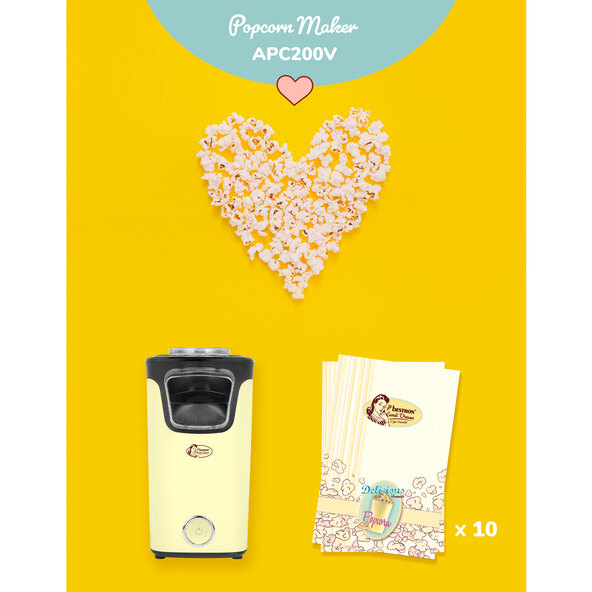 Gelbe Popcornmaschine im Retro-Design mit transparentem Behälter, der fertiges Popcorn zeigt.