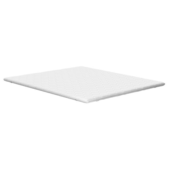 Weiche, weiße Matratzenauflage Basis (180x200cm) auf einem Bett, perspektivisch aufgenommen, Fokus auf die Oberfläche mit leichter Struktur.