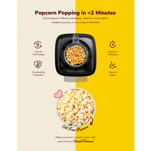 Blaue Popcornmaschine mit transparentem Deckel und Messbecher, stehend auf einer Oberfläche. Fertiges Popcorn ist im Behälter sichtbar.