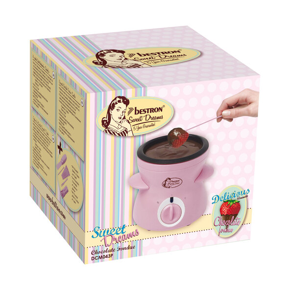 Pinkfarbenes, elektrisches Mini Schoko-Fonduegerät mit zwei Gabeln und Schokoladenstückchen. Ideal zum Schmelzen von Schokolade für ein kleines Fondue.