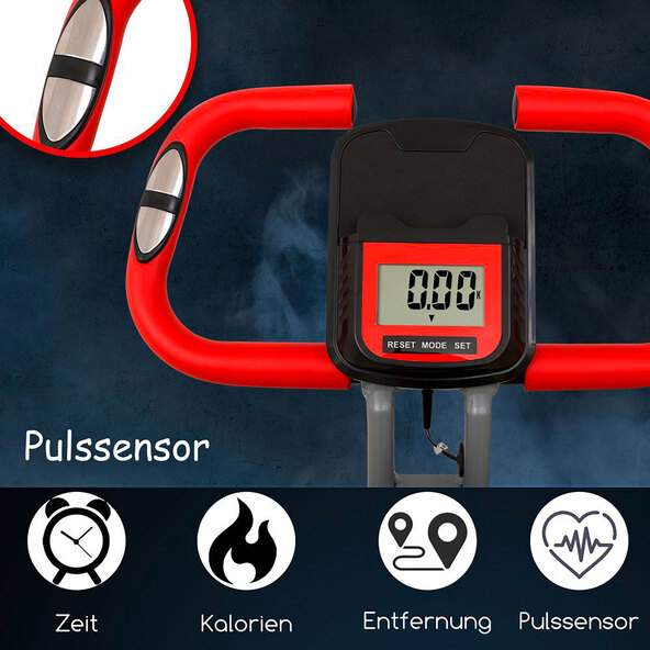 Heimtrainer F-Bike Curved in zusammengeklapptem Zustand, seitlich fotografiert. Das Fahrrad ist schwarz mit roten Akzenten und steht auf einem hellen Untergrund.