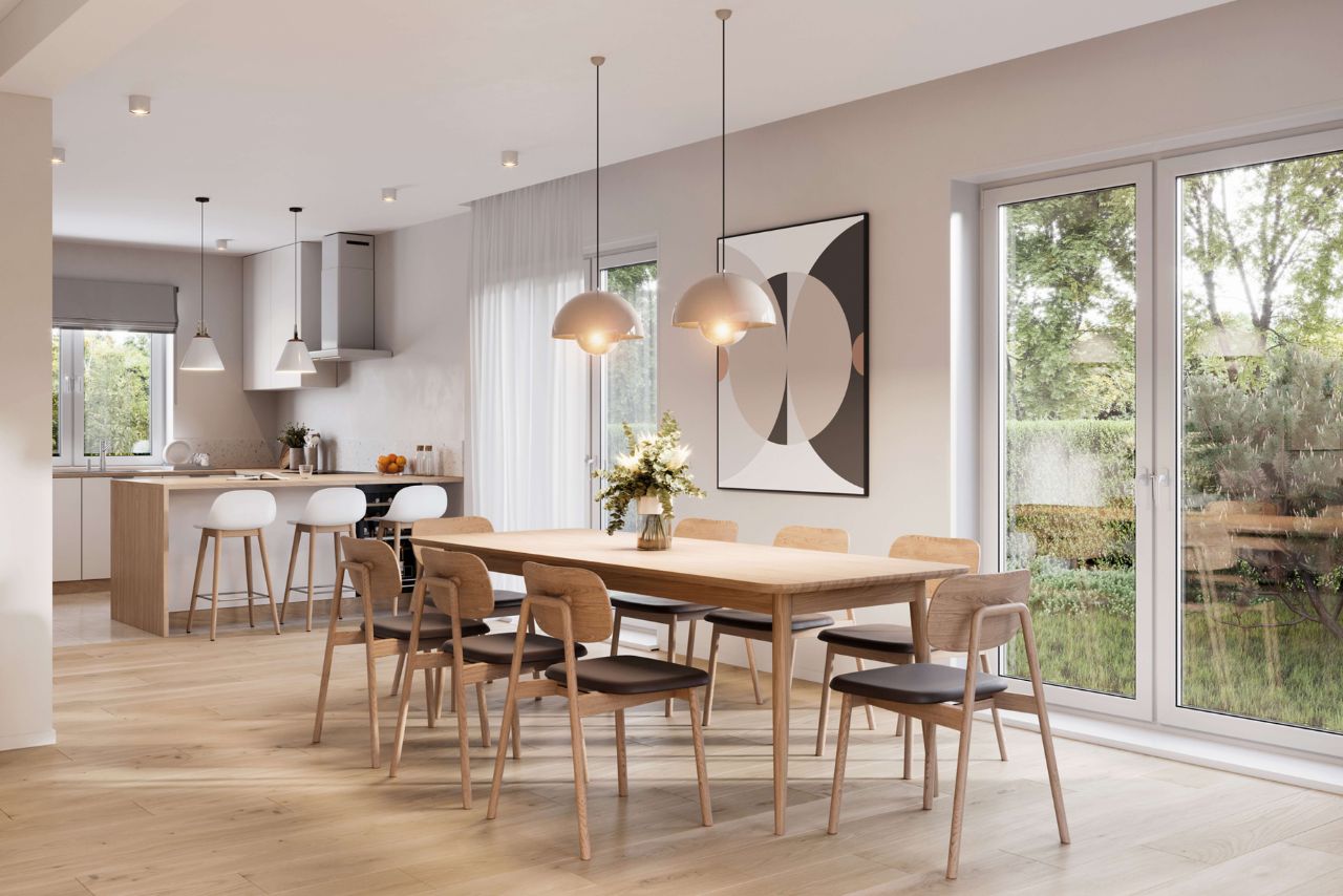 Helles, modernes Esszimmer mit großer Essgruppe aus hellem Holz und offener Küche in Weiß und hellem Holz im Hintergrund