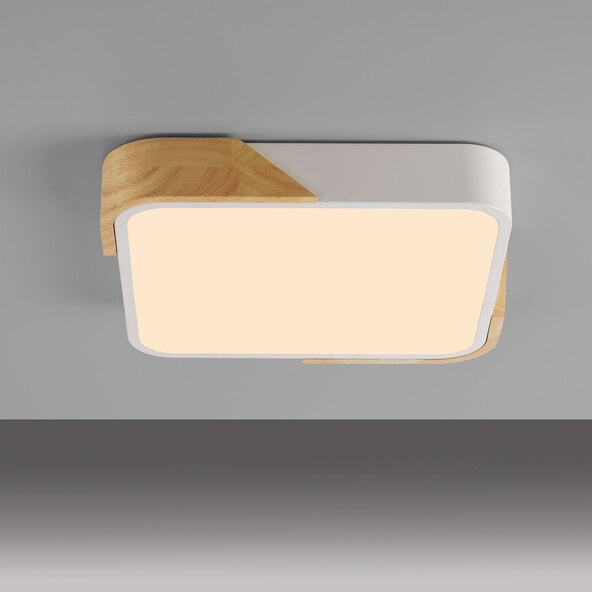 Weiße, quadratische LED-Deckenleuchte BILA mit abgerundeten Ecken, die ein helles, gleichmäßiges Licht abgibt und schlicht an einer Decke montiert ist.
