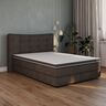 Matratzen Topper Luxe mit Gel Active Schaum ausgerollt auf einem Bett, weiße Oberfläche mit erkennbarer Struktur und bläulichen Gel-Einschlüssen.